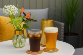 Pint Glasses with Beer and Soda in an Outdoor Hotel Setting
