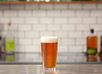 Aura Beer Pint on Bar Counter